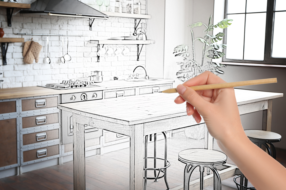 kitchen being designed by a hand with pencil